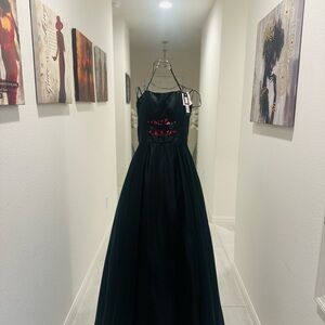 Betsy & Adam, Elegant Black Gown with Hot Pink Accents.